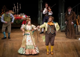 Mr. and Mrs. Fezziwig dance together in A Christmas Carol