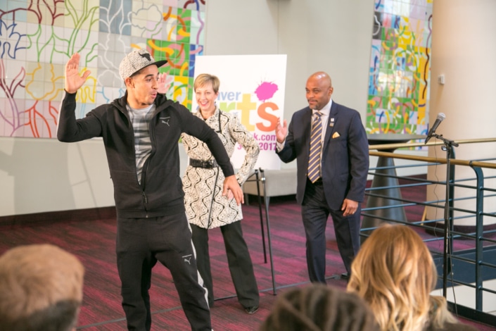 In the foyer of the Buell Theatre, French hip-hop dancer Salah from Breakin’ Convention demonstrates a move as Denver Center CEO Janice Sinden and Denver Mayor Michael Hancock follow along