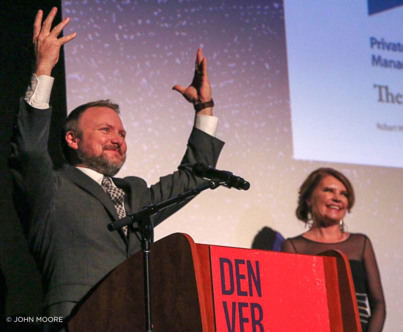 'Knives Out' director Rian Johnson accepts the John Cassavetes Award at the 2019 Denver Film Festival from Festival Director Britta Erickson. Photo by John Moore.