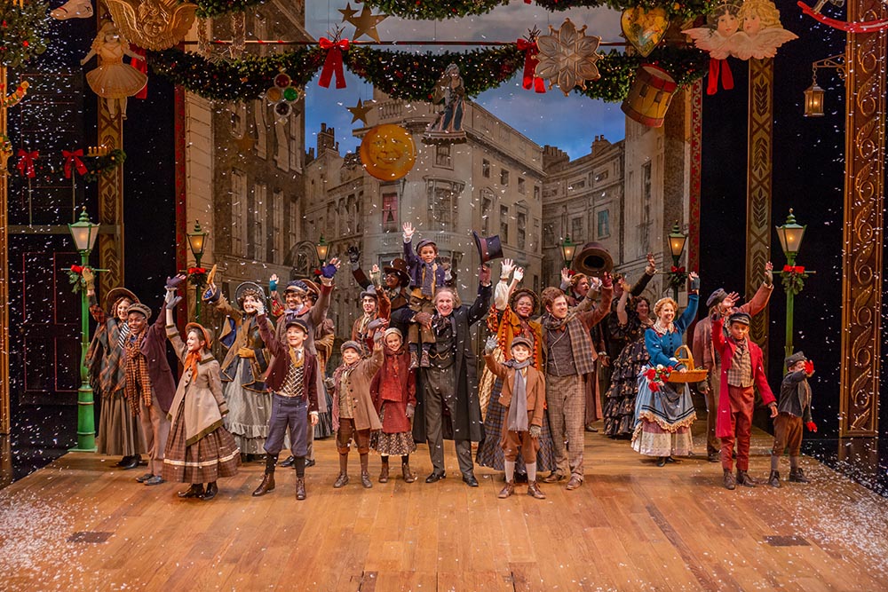 The 2018 Cast of A Christmas Carol waving