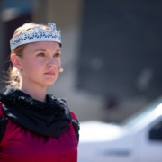A close up of a performer dressed as a queen
