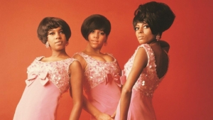 Mary Wilson, Florence Ballard and Diana Ross of The Supremes pose in pink dresses