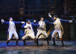 the company of Hamilton Broadway Tour dances onstage