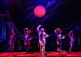 Actors dressed in cat costumes pose while they dance in CATS the musical