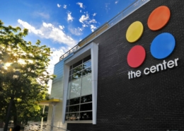Exterior of The Center with a blue sky in the background