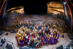 The Choir League poses for a photo onstage at Red Rocks