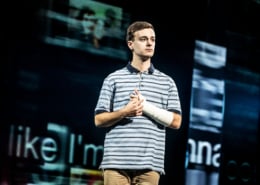 Evan Hansen holds his arm cast close to his chest in Dear Evan Hansen