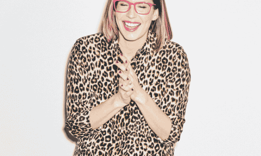 A headshot of Lauren Gunderson as she laughs