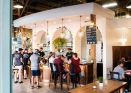 A light and airy bar filled with people