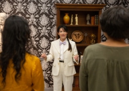 A person stands speaking to a group
