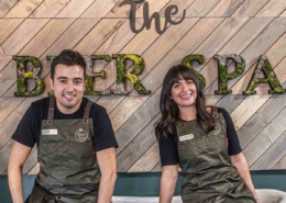 Two people sit in on a tub in the Beer Spa