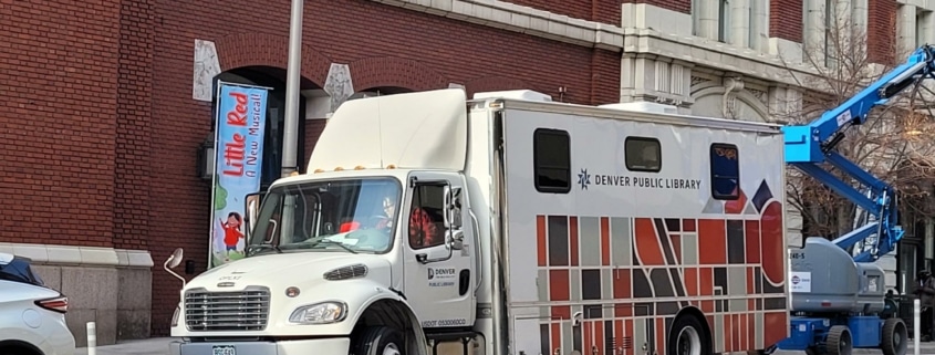 A large semi truck called the Bookmobile outside the DCPA