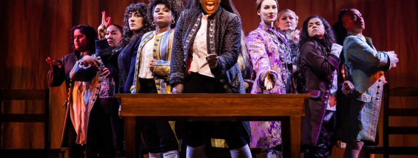 The cast of 1776 stands onstage as they sing