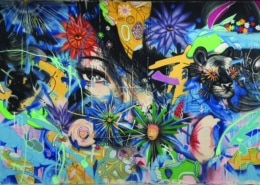 The graffiti style painted backdrop for Laughs in Spanish