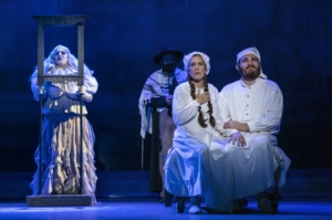 Golde and Tevye, dressed for bed, imagine Tevye's dream in Fiddler on the Roof
