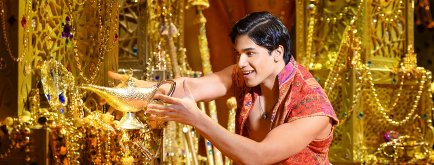 Aladdin reaches for the magic lamp in the underground treasure trove, the Cave of Wonders