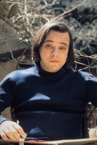 Stephen Sondheim in the 1970s, outside writing in a book