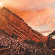 Thousands of people sit at Red Rocks