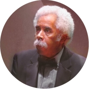 A headshot of Purnell Steen. He's wearing a suit jacket and bowtie.