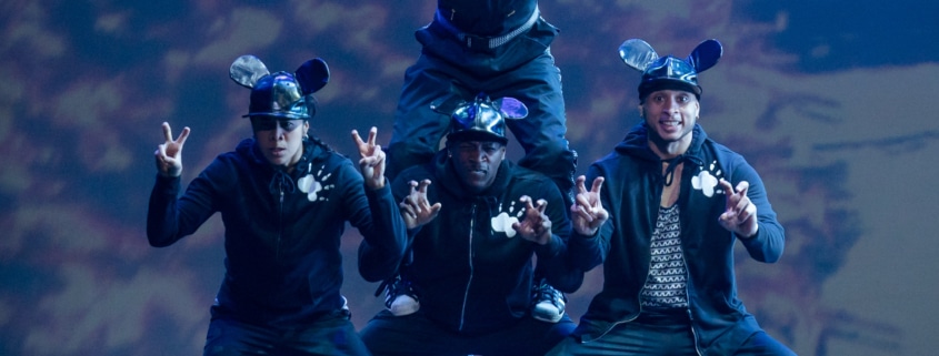 Dancers dressed as mice form a pyramid