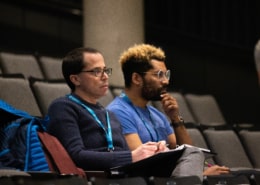 Playwright Andrew Rosendorf sits with director Chip Miller during rehearsal. They are deeply invested in what's happening onstage.