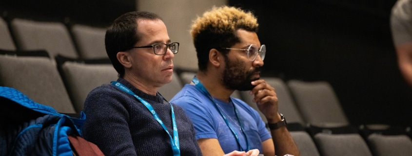 Playwright Andrew Rosendorf sits with director Chip Miller during rehearsal. They are deeply invested in what's happening onstage.